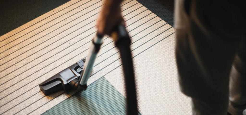 House cleaner vacuuming floors - Milton Maids